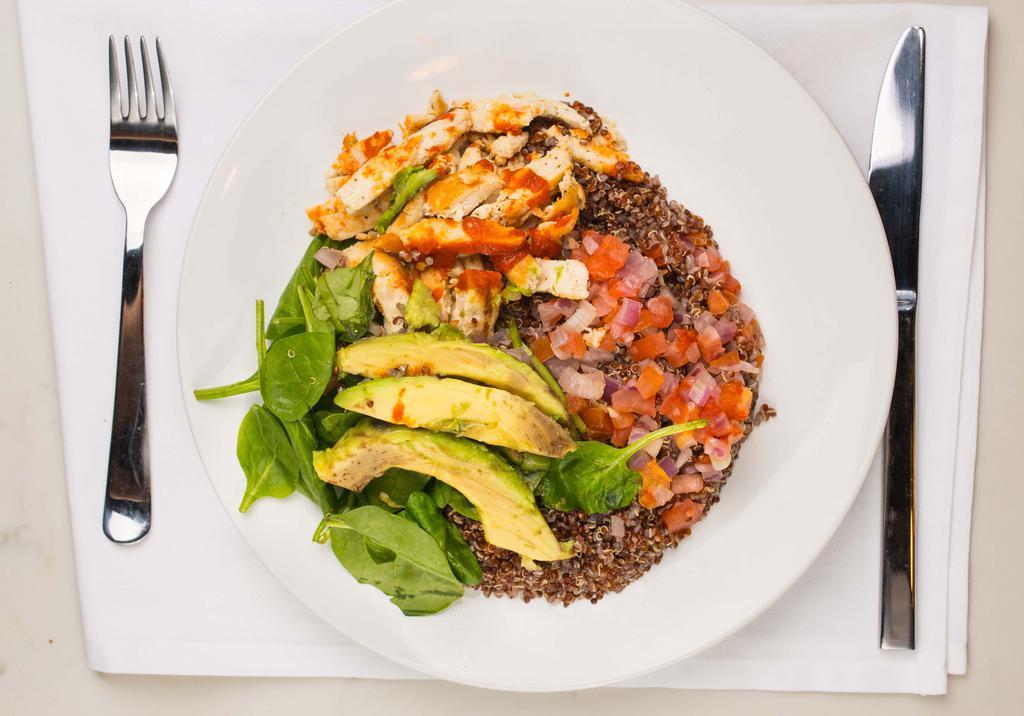 Grilled Chicken Bowl · Served with delicious grilled chicken, avocado, spinach and quinoa with your choice of sauce!