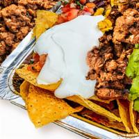 Impossible Beef Nachos · Corn tortilla chips loaded with melted cheese and choice of toppings