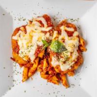 Chicken Parmigiana · Breaded chicken cutlet, tomato sauce, and mozzarella. Served with your choice of pasta or sa...
