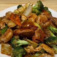 Gf Happy Family · Scallops, shrimp, chicken and beef sautéed with fresh broccoli, water chestnuts, Napa, pea p...