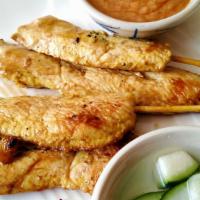 Chicken Satay · Marinated grilled meat skewers served with peanut sauce (made with coconut milk) and cucumbe...
