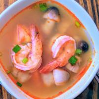 Tom Yum Goong · Mild.  Shrimp with red onions, tomatoes and mushrooms in a hot and sour vegetable broth.  Mi...