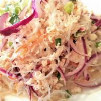Woonsen Salad · Glass noodles with ground chicken, red onions, carrots, tomatoes and scallions in a lime sau...