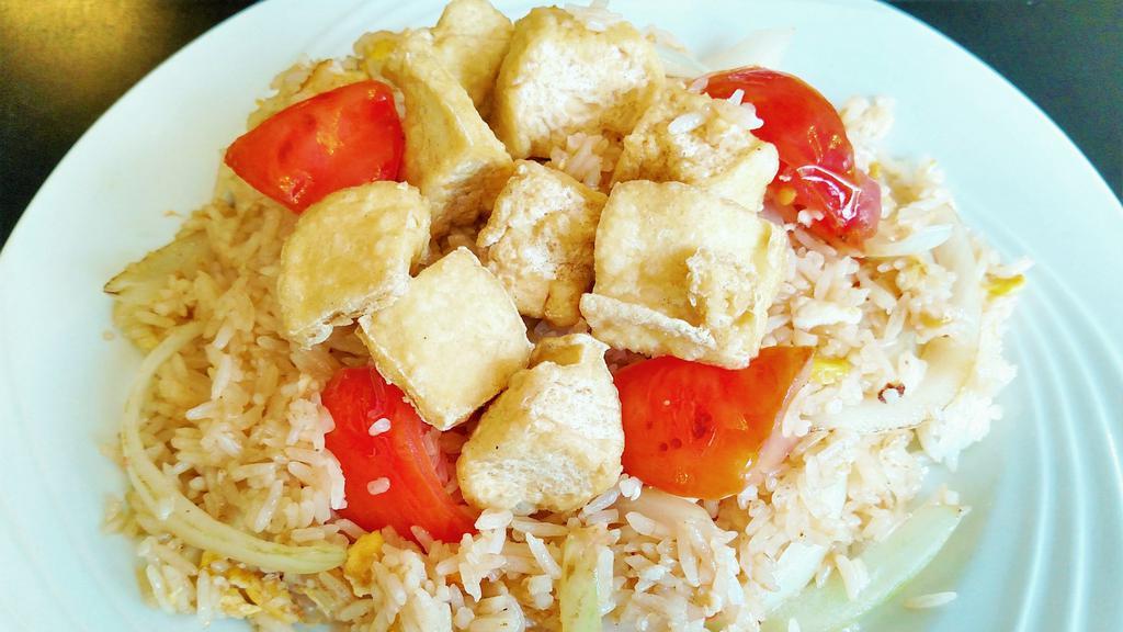 Thai Fried Rice · Traditional Thai fried rice with eggs, tomatoes, and onions.
