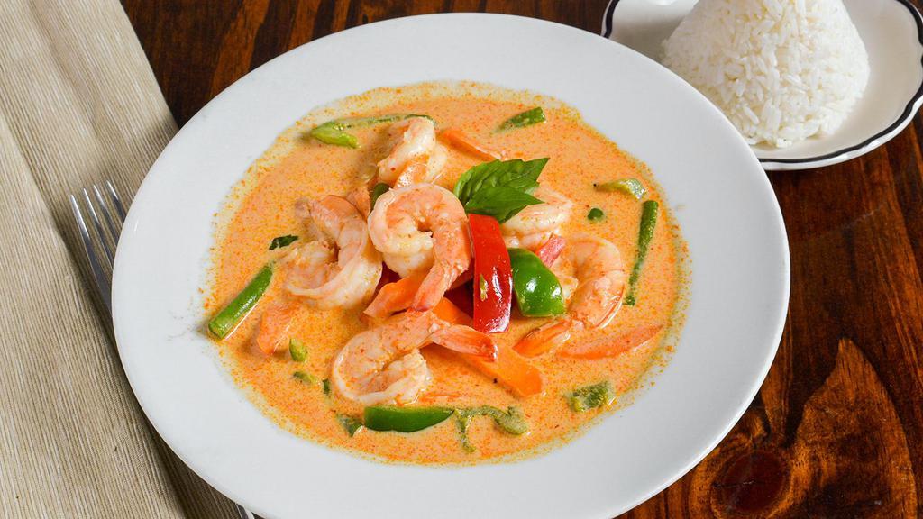 Red Curry · Spicy. Red curry paste, coconut milk, string beans, carrots, bamboo shoots, basil and bell peppers.