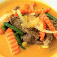 Yellow Curry · Yellow curry paste, coconut milk, potatoes, string beans, carrots, and onions.