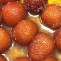 Gulab Jamun · Sweet and soft dough balls smothered in sugar syrup.