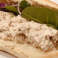 Tuna · Served with lettuce, tomatoes, onions, oil and vinegar, mayonnaise, and mustard.