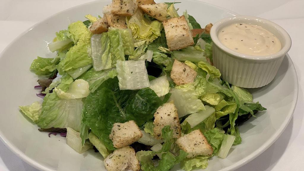 Caesar Salad · Romaine lettuce, croutons, parmesan cheese, and tossed with caesar dressing.