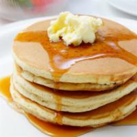 Classic Buttermilk Pancakes · Three classic, homestyle pancakes. Served with butter and maple syrup.