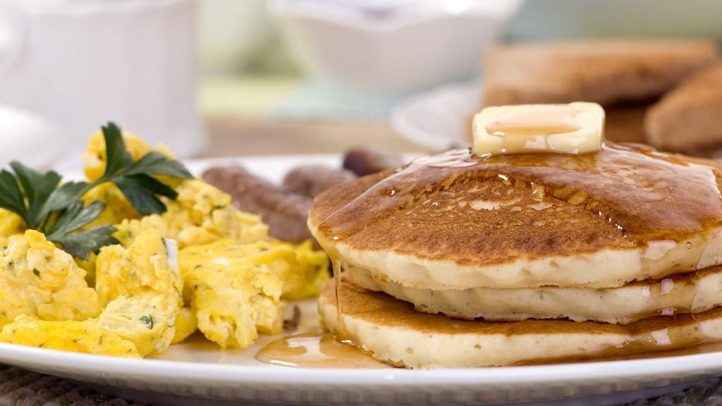 Pancakes With Scrambled Eggs · Three buttermilk pancakes served with two scrambled eggs, butter and maple syrup.
