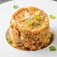 Peruvian Arroz Chaufa  · Cooked rice mixed with scallions, chopped egg all sautéed in work with soy sauce. Choice of ...