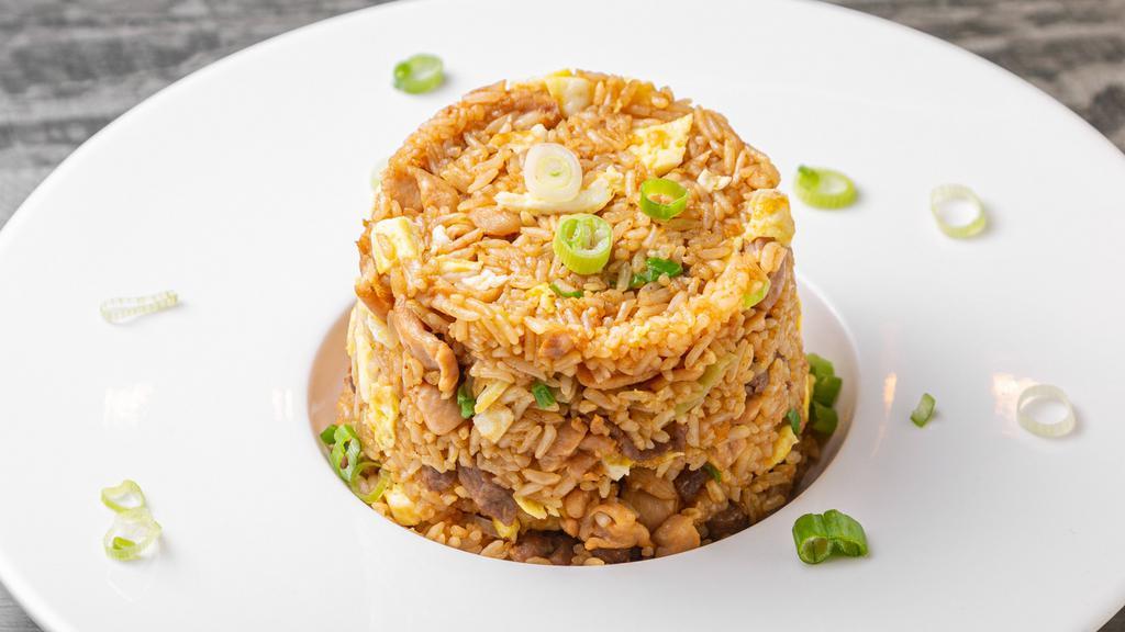 Peruvian Arroz Chaufa  · Cooked rice mixed with scallions, chopped egg all sautéed in work with soy sauce. Choice of beef, chicken or mixed.