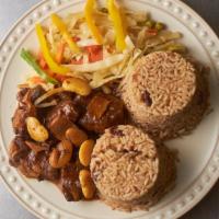 Oxtail · Serves with steamed veggies fried plantains and your choice of either: rice and peas or whit...