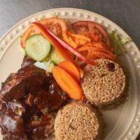 Jerk Pork Meal · Serves with steamed veggies fried plantains and your choice of either: rice and peas or whit...