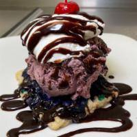 Wild Berry Poptart Sundae · One scoop of black raspberry ice cream with chocolate syrup, homemade whipped cream & a cher...