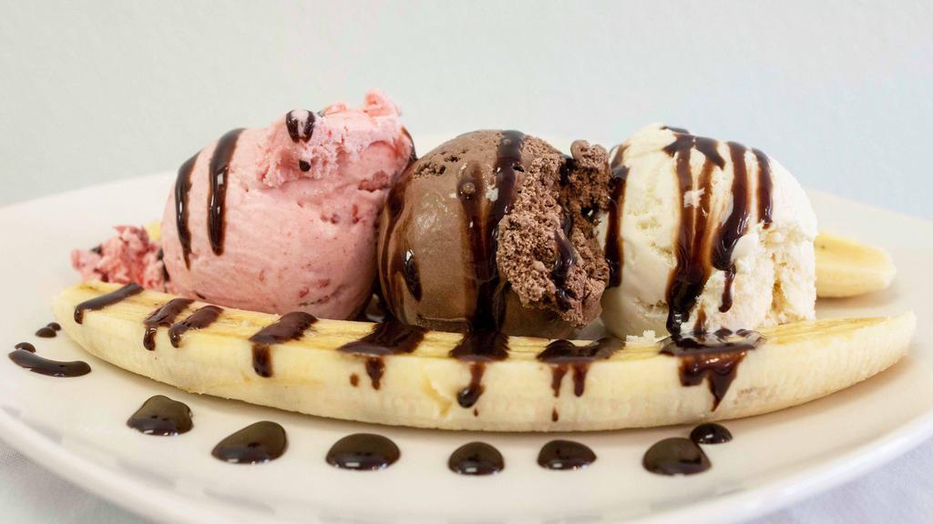 Banana Royal · Three scoops of ice cream, two toppings, one banana, whipped cream and a cherry on top.