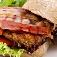 Grilled Chicken Sandwich With Cheese And Bacon · Charcoal grilled free range chicken served on a potato bun with cheese, bacon, lettuce, toma...