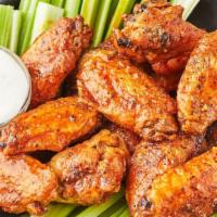 Wings · A basket of crispy wings w/ your choice of any sauce: Hennessy, Honey Garlic, Garlic Parmesa...