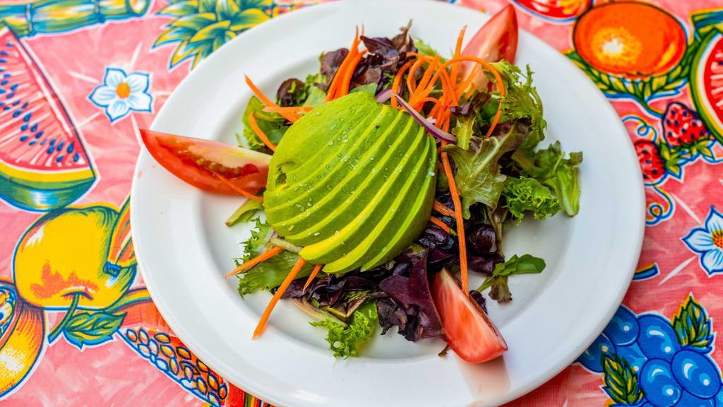 Avocado Salad · With romaine lettuce, avocado, tomatoes, red onions, carrots, peppers, and radishes. Vinaigrette-garlic dressing.
