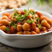 Vegan Chana Masala · Gluten free, vegan. Hearty chickpeas slow stewed in a tomato curry sauce and served with a s...