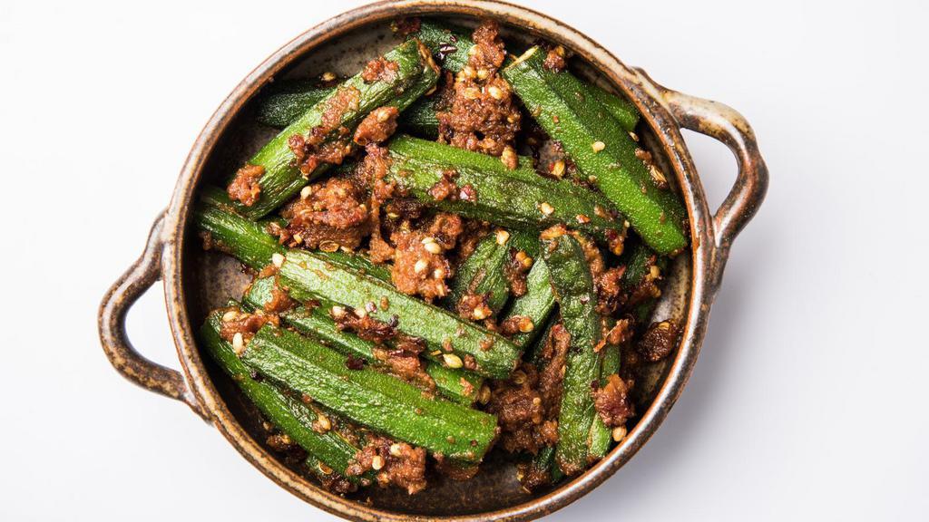 Vegan Bhindi Masala · Gluten free, vegan. Fresh okra sautéed with onions, tomatoes, and traditional ground spices and served with a side of vegan basmati rice.