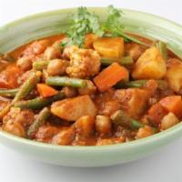 Vegan Gajar Mattar · Vegan. Locally grown carrots and green butter peas prepared with onions and traditional grou...