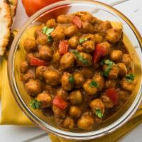 Vegan Puri Cholay · Vegan. Savory spiced chickpea stew served with a traditional light and airy puri bread.