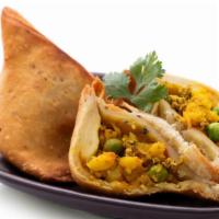 Vegan Vegetable Samosa · Tender spiced peas and potatoes filled into a crispy turnover served with mint and tamarind ...