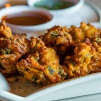 Vegan Bread Pakora · Vegan. Crispy bread fritters filled with tender potatoes and served with mint and tamarind c...