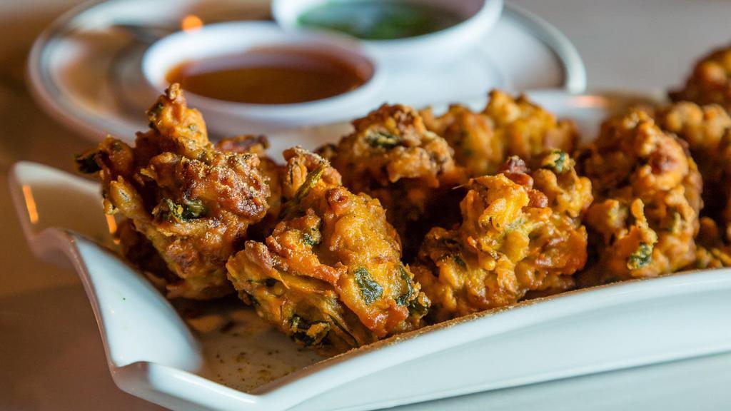 Vegan Bread Pakora · Vegan. Crispy bread fritters filled with tender potatoes and served with mint and tamarind chutneys.