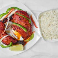 Tandoori Chicken · 1/2 chicken on the bone marinated in yogurt and spices cooked in the tandoor. Served over a ...