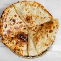 Peshwari Naan · Tandoori oven-baked bread with sweet filling with a mixture of sultanas, almonds, coconut, a...