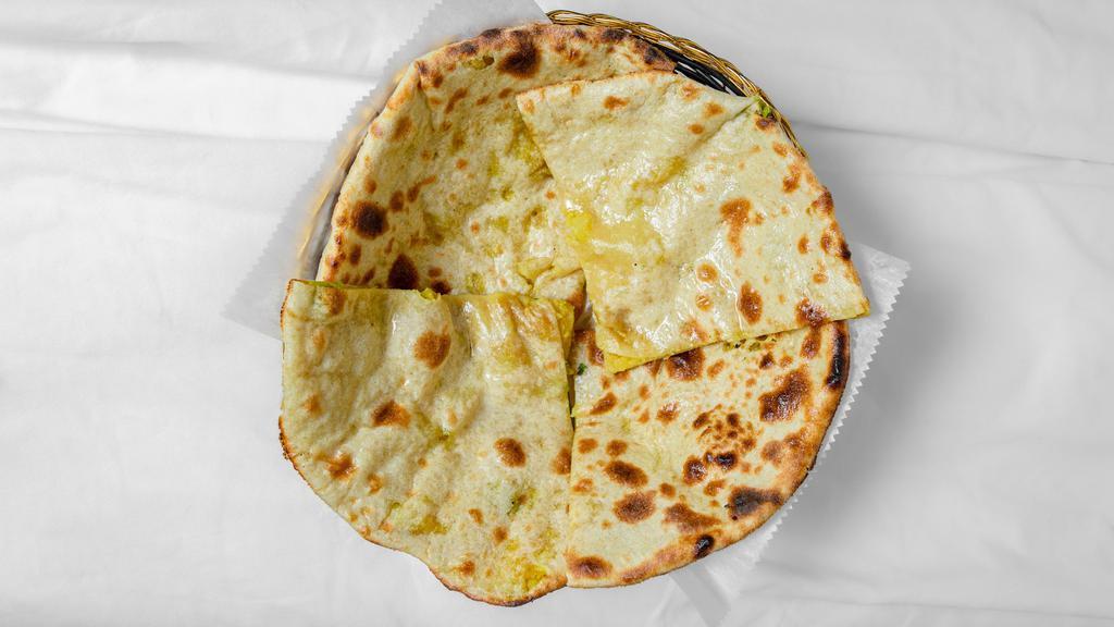 Aloo Paratha · Whole wheat bread stuffed with potatoes.