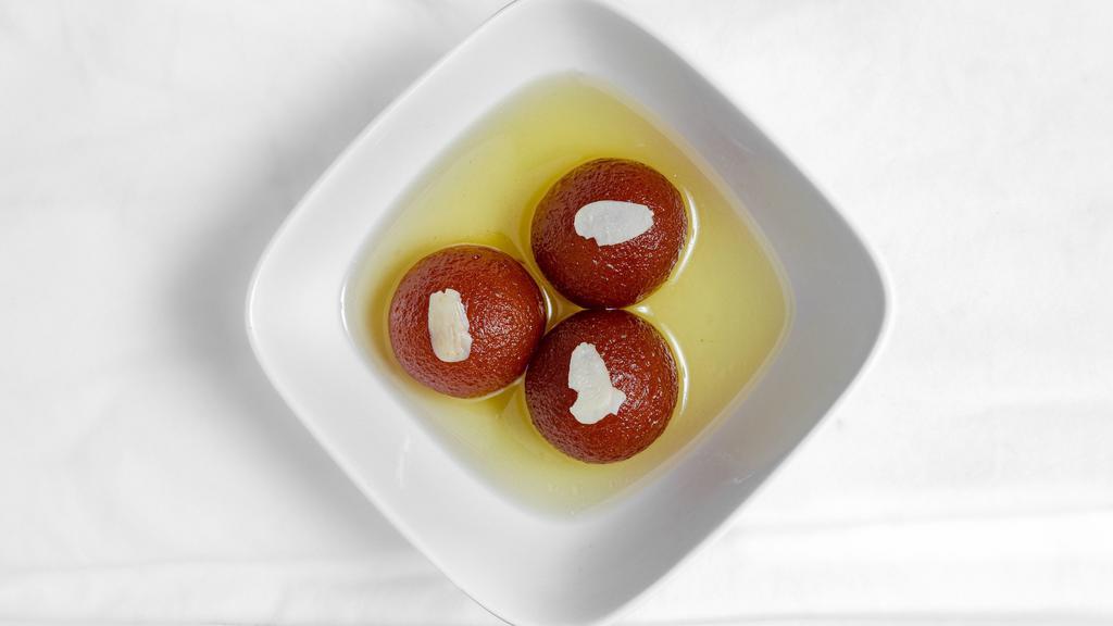 Gulab Jamun · Classic festive dessert made with fried dough balls that are soaked in a sweet syrup.