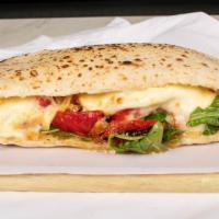Romana · Grilled chicken, mozzarella, roasted red peppers, arugula, and balsamic dressing on ciabatta.