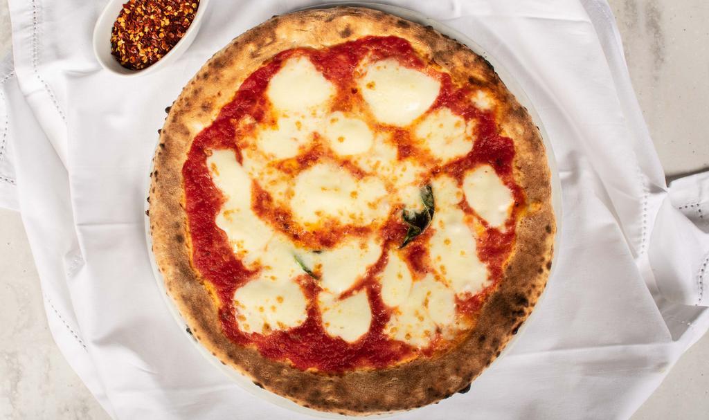 Margherita · Tomato sauce, mozzarella, basil, and extra virgin olive oil.