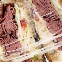 The Quogue · Pastrami, onions, melted swiss, coleslaw on grilled rye.