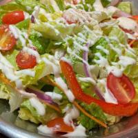 Garden Salad · Crisp hearts of romaine and baby arugula mixed with red onions, carrots, red & green peppers...