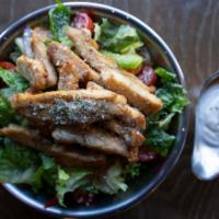 Grilled Chicken Salad · Tender strips of grilled chicken with crisp hearts of romaine and baby arugula mixed with re...
