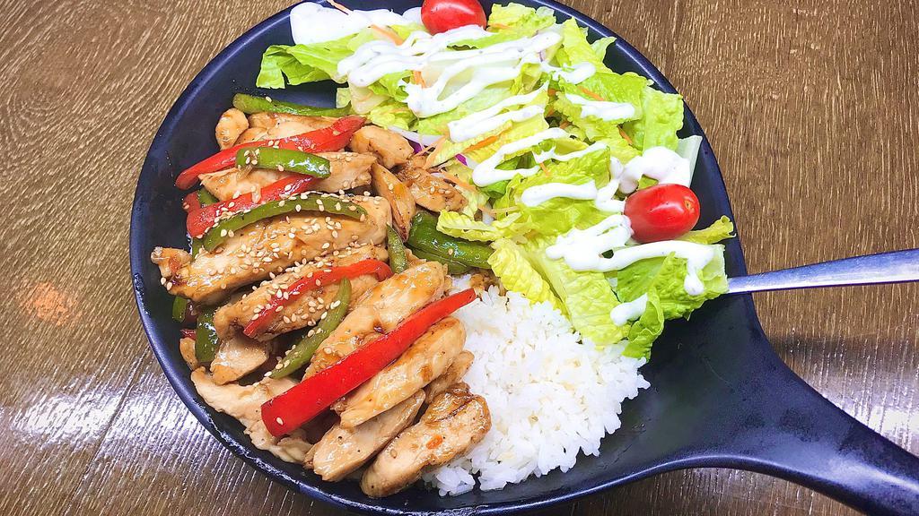 Chicken Teriyaki · Chicken Teriyaki Over Rice and with a Side of Salad.