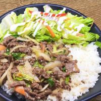 Bulgogi Over Rice · Steamed white rice topped with Korean style marinated beef with assorted vegetables.