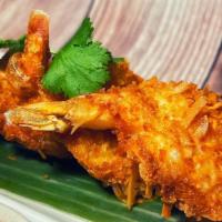 Coconut Shrimps · Fried coconut shrimp served with sweet chili sauce.