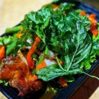 Gra Prao Ped Yang · Half roasted duck, bell pepper, onion, carrot, string bean in chili basil sauce topped with ...