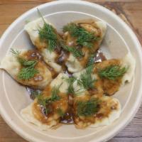 Meat Pierogi (6) · 6 pierogi filled with a mix of braised beef cheeks and pork butt served with meat gravy and ...