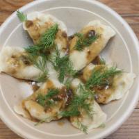 Sauerkraut & Mushroom Pierogi (6) · Vegetarian classic! 6 pierogi filled with a tangy mix of sauerkraut and wild mushrooms serve...