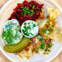 Pierogi Vegetarian Platter · Two potato and cheese pierogi, two sauerkraut and mushroom pierogi with caramelized onions a...