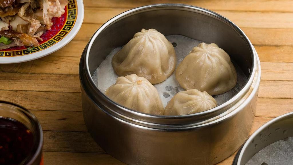 Pork Soup Dumplings · Pork dumplings filled with soup. Wait time 10 minutes (4 pieces).