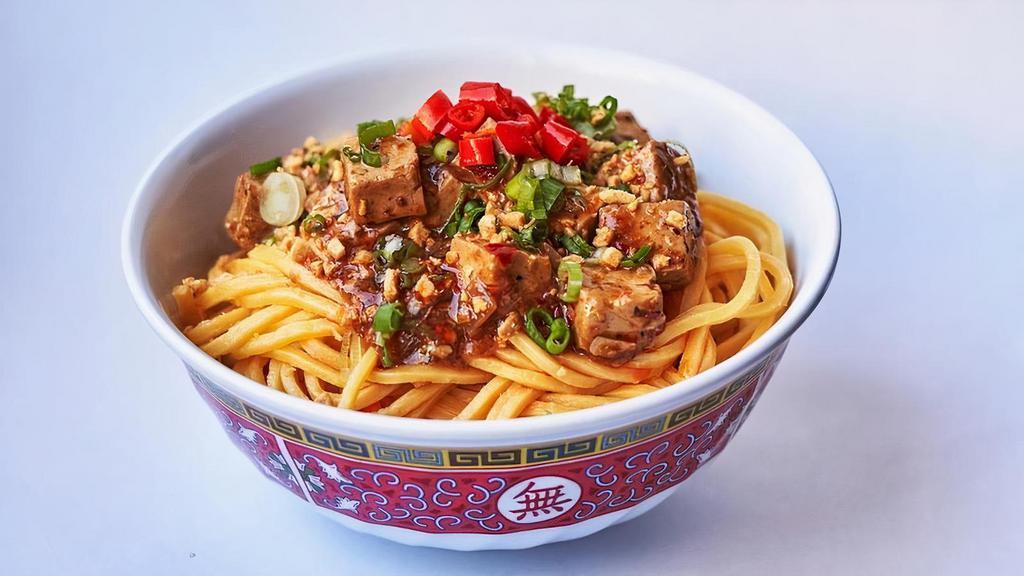 Szechuan Tofu Noodles (Vg) · Braised tofu, fried garlic, and chili. Served over egg noodles. (Vegetarian)