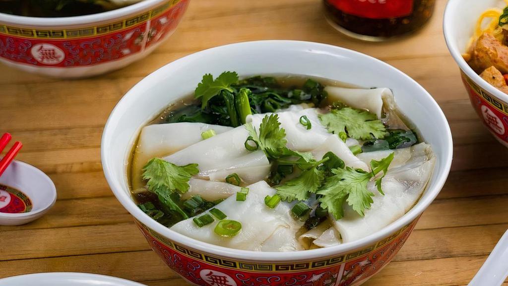 Ho Fun Noodle Soup (V, Gf) · Wide rice noodles and Chinese greens in roasted vegetable broth, garnished with scallion and cilantro. Vegan and Gluten Free.